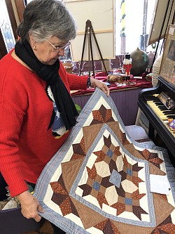 Mrs Cayer with quilt