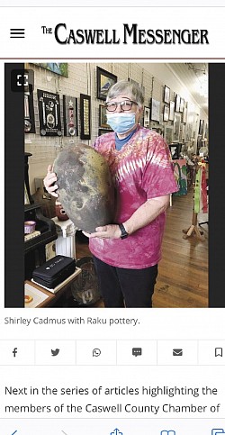 Caswell messenger photo of Shirley Cadmus holding one of her Raku pots
