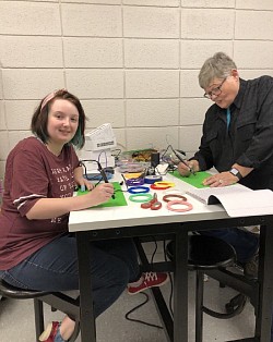 Shirley Cadmus Helping a student use3D pen at Gunn Memorial Library. Yanceyville, NC
