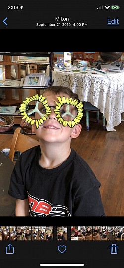 Gallery visitor with peace glasses