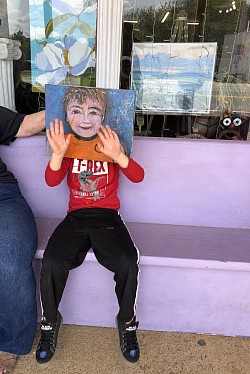 Joetta with great grandson. Showing off his portrait by S Cadmus