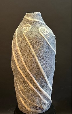 Large,  3 D Pen, form with Glo in dark white bands spiraling upward Cadmus